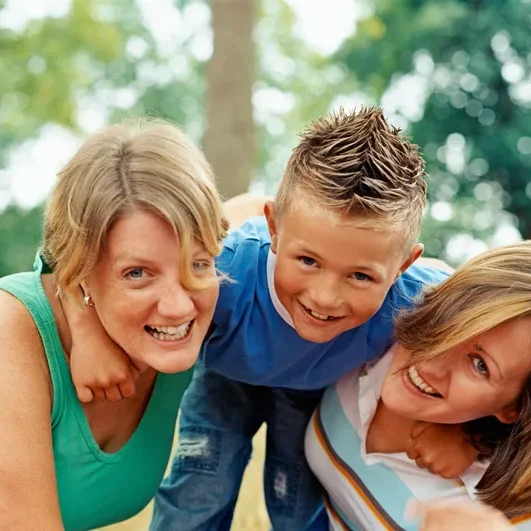 A woman and two women with a boy.